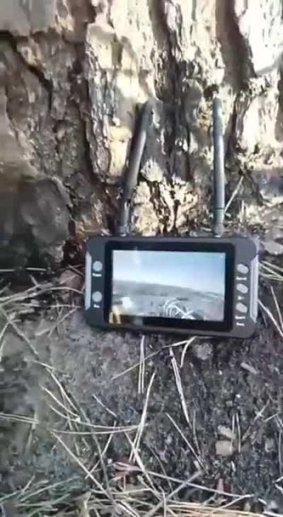 Russian military personnel use a Chinese monitor 'Sologood' to intercept and view video footage from Ukrainian FPV drones.