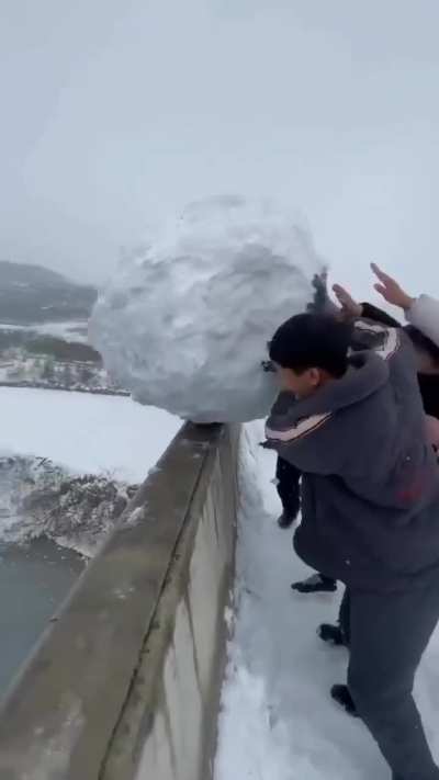 throwing a snowball off a bridge