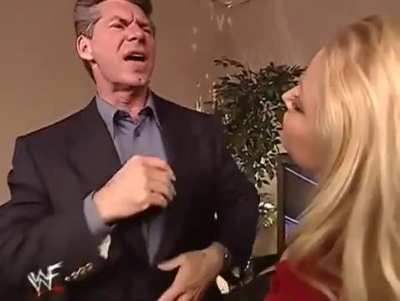Trish gives Vince a good luck kiss