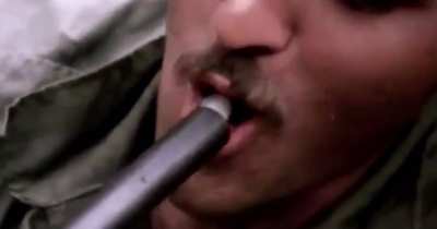 American soldiers in Vietnam smoking Marijuana out of the barrel of a Shotgun, 1970.