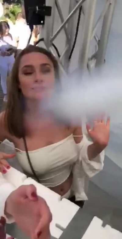 Party girl has her shirt blown down, bare tits exposed