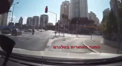 Person on an electric bike almost gets hit by a car after passing 2 red lights