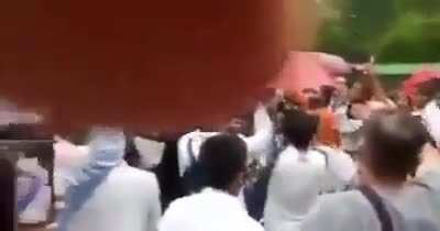 A mob shouting 