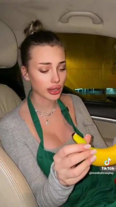 She nibbles on the banana