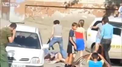 Russian Woman Knocks a Girl Out with a Tire Iron in Odd Skirmish
