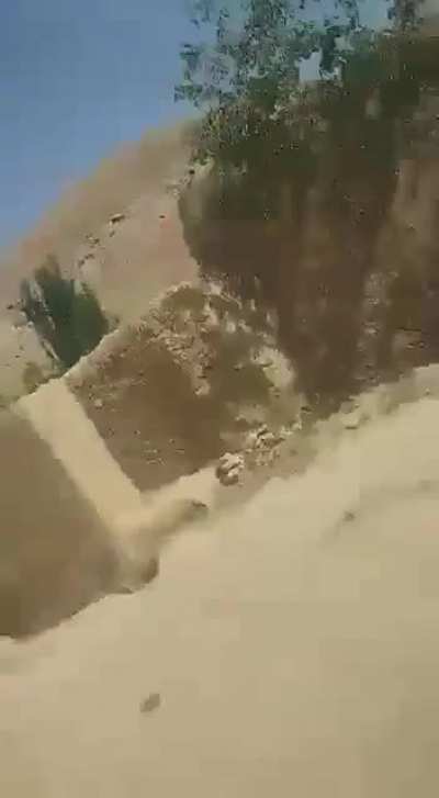 Taliban whipping and beating an elderly man