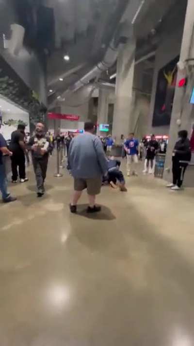 Human-shaped pitbull assaults 2 people over a football game.