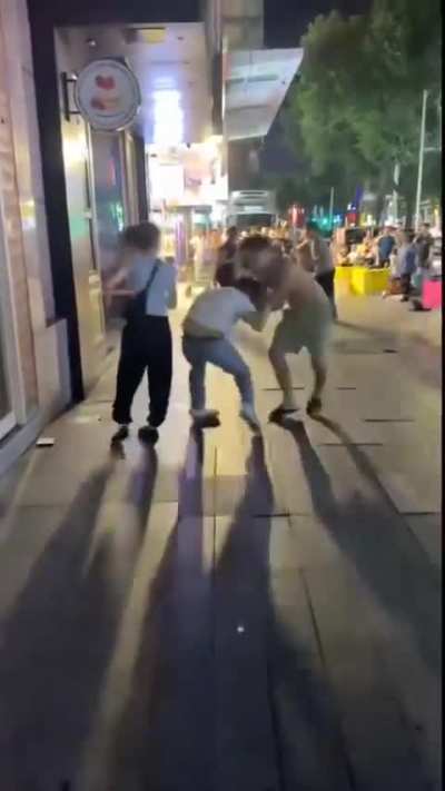 Multiple guys and one woman had a fight, but that woman dealt like 0.1 damage.