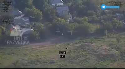 Ukrainian Strela-10 misses when trying to shoot down a Russian observation drone, then a Lancet is sent to attack Strela-10 and hits the top of the tree that protected the air defense. Toretsk, Donetsk Region. May 2024