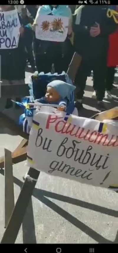 Ukrainian civilians in Kherson play "Bayraktar" for the Russians as they protest against the occupation