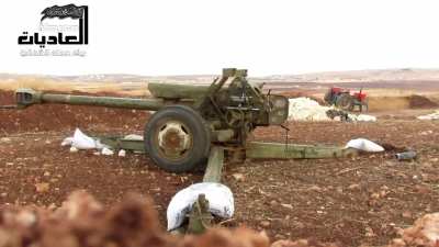 FSA fighters operating a captured D-30 howitzer as a direct fire weapon - N. Hama - 9/19/2013