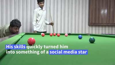 Born without arms. Plays snooker with his chin.