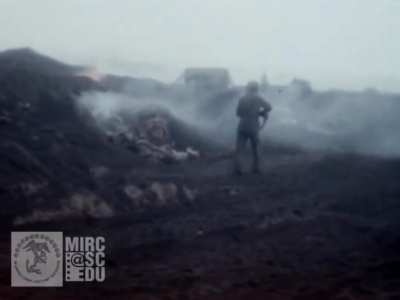 [WW2] US Marines use a flame thrower to burn out a Japanese soldier hiding in a bunker. He stumbles out and is killed by machine gun fire. February 23rd, 1945. Iwo Jima. 4th Marine Division.