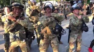 The Georgia National Guard dancing the "Macarena" alongside peaceful protesters in Atlanta
