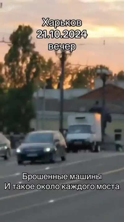 UA POV: Video from Kharkov. Caption in the video: "Abandoned cars.  And such picture  is near every bridge.". The inscription on the truck: Saltovsky meat processing plant.
