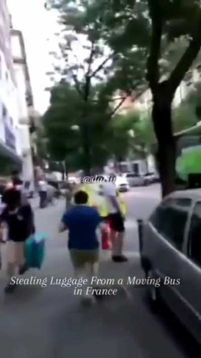 Stealing luggage from a moving bus in France