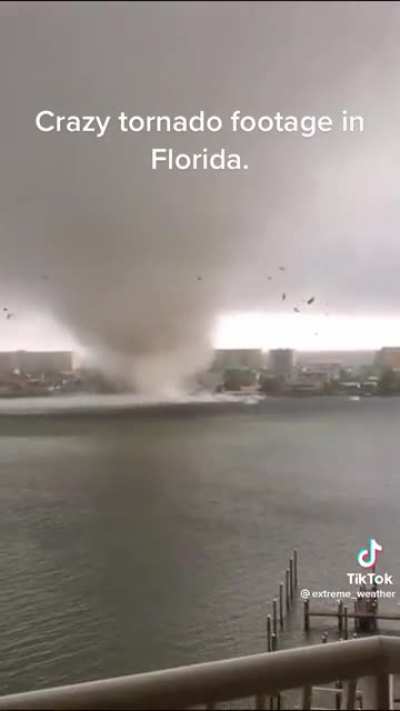 Awesome video of a water spout/tornado doing damage. The camera man stayed steady and doesn&rsquo;t leave. Great footage.