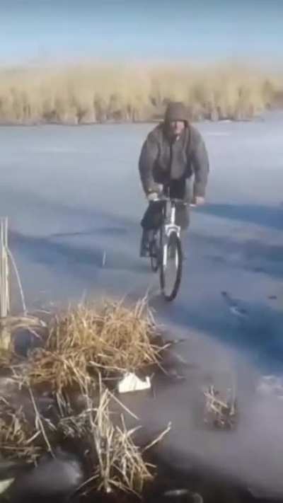 WCGW riding a bike on a frozen river
