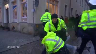 Showing the Nazi Salute infront of German Police