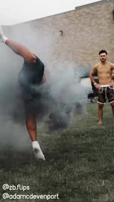 Running frontflips while holding a smoke bomb