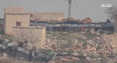 Hayat Tahrir al-Sham sniper headshots Syrian soldier and his head explodes