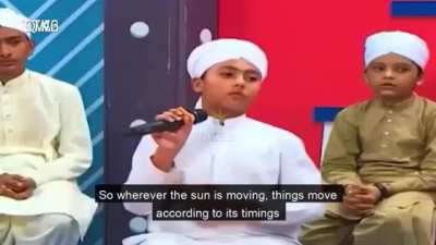 Islamic Cleric teaching kids that the Earth does not move and the Sun revolves around the Earth as per the Quran.