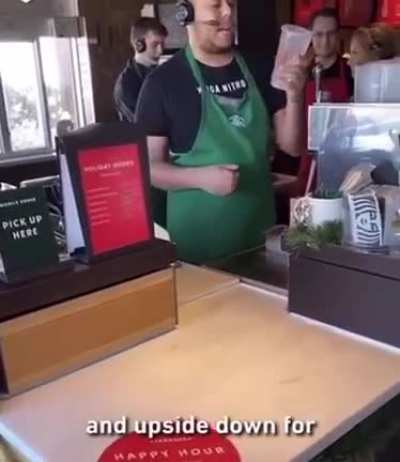 Starbucks employee reading out an order