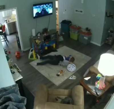 Lying down next to robot vacuum