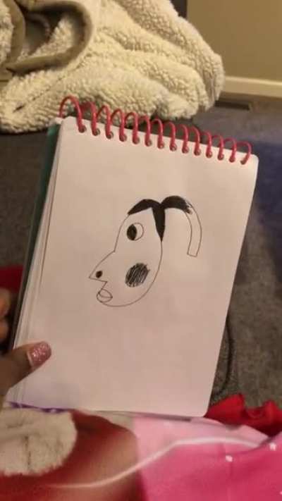 Daughter draws her mother&rsquo;s face, and doesn&rsquo;t know why her dad is laughing.