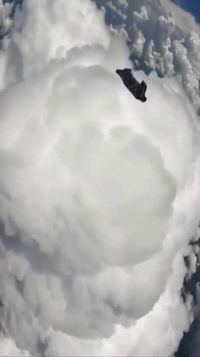 casually skydiving amongst the puffy clouds