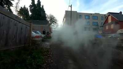 Portland Red House (#4): An Antifa militant runs up behind Portland cops and sprays them with a fire extinguisher.