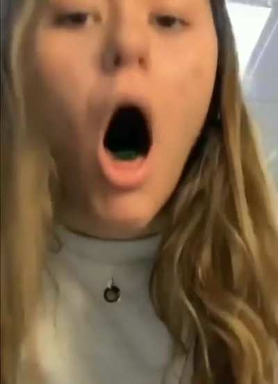 Trying to swallow a long piece of gummy candy