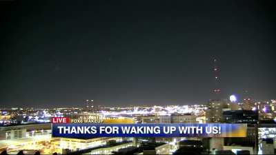 In this Live broadcast, news anchors audibly react to numerous UAP orbs visibly flying around the sky on the live &ldquo;city-cam&rdquo; 