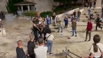 Daily life under occupation- Palestinian youth organize to clean up at Damascus Gate after the Israeli "death to Arabs" flag parade in the old city of Jerusalem. Israeli police promptly attacks them for no apparent reason and throws away their brooms.