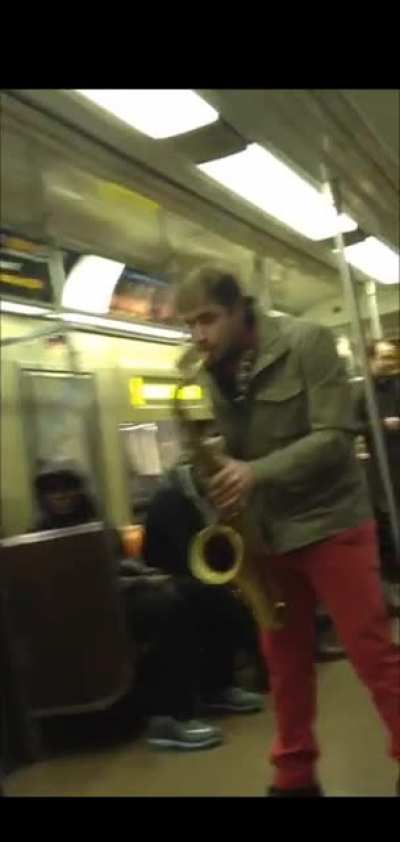 Saxophone battle between two street performers