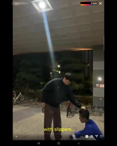 Some kid with slippers snitches or something and gets whooped by older bully while recording live for views.. (warning expletives)