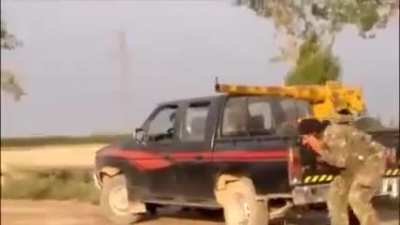 Opposition fighters operate a homemade "Omar Cannon" against SAA positions out of the bed of a Nissan pickup truck - Deir ez-Zor - 2013