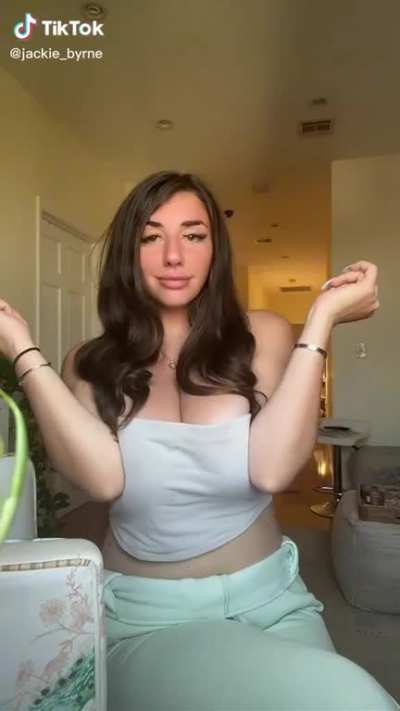 Tiktok User "jackie_byrne" Squeezing Her Clothed Boobs Together With Her Arms Trying And Failing To Push Her Elbows Together (Also With Slo-Mo)