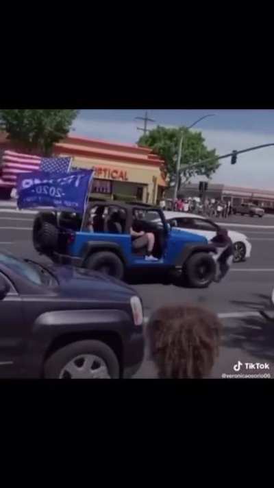 Jeep hits protesters blocking the roadway