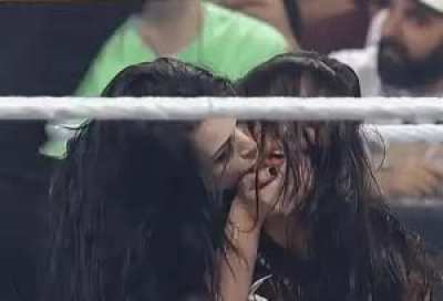Paige gives AJ a kiss
