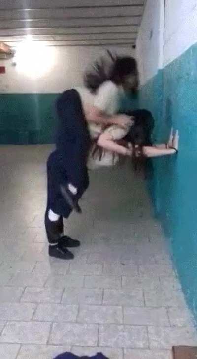 Girls try to stack up on top of each other