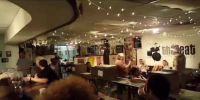 Guy in a tinfoil hat heckles a comedian, fucks around and finds out.