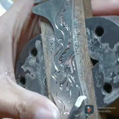 Carving dragon on metal comb handle