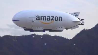 Amazon blimp releasing drones