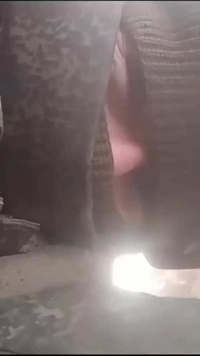 What appears to be a Chechen solider taking cover from small arms and explosions (Location, date unknown)