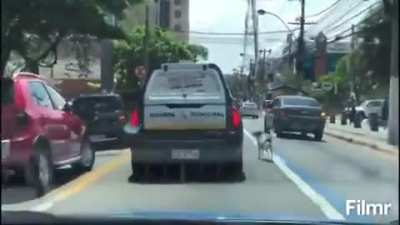 Dog chasing police car in Brazil, because his "owner" (a homeless man) was taken to be ID'd.