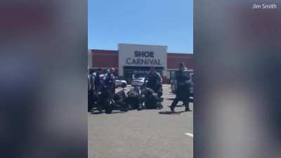 Q: How many violent cops does it take to change a lightbulb? A: Not as many as it does for them to drag two women out of a car. Apparently.