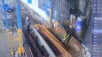 Man unloading heavy pipes
