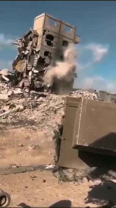 IDF troops take down the remaining superstructure and collapse a building using a 30mm Bushmaster (1-20-25)