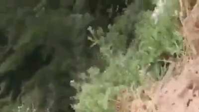 Somebody built a dirtbike track right next to a cliff!